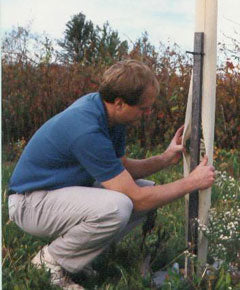 Tree Pro Tree Protector with company owner Tom Mills showing the slit tree tube design.
